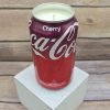 Hand-poured Cherry Coke soy candle in a recycled Coca-Cola can from 716 Candle Co.