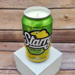Upcycled soda can holding the Starry soda pop soy candle