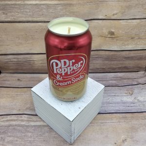 In an upcycled can, this hand-poured soy wax Dr Pepper Cream Soda candle's ready.