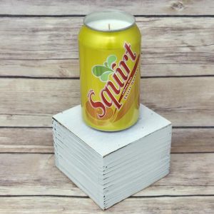 Hand-poured soy wax candle in an upcycled Squirt can