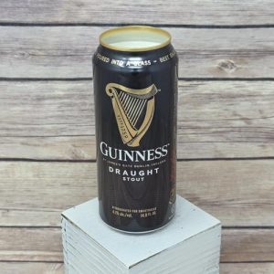 Candle label on an upcycled Guinness Draught beer can