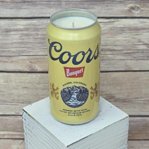 Soy wax candle in an upcycled Coors Banquet can, close-up view