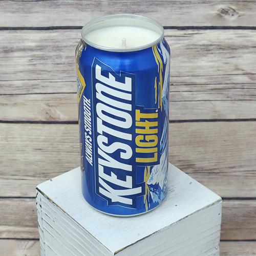 Upcycled beer can containing a Keystone Light Camo soy wax candle.