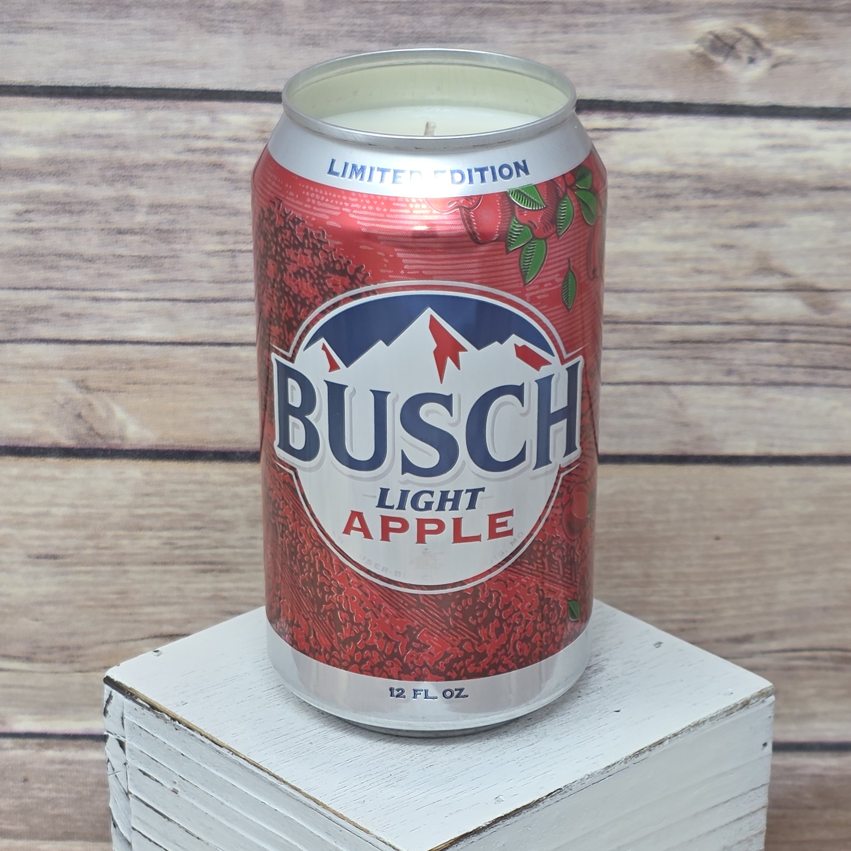 Busch Light Apple candle poured into its original, upcycled can.